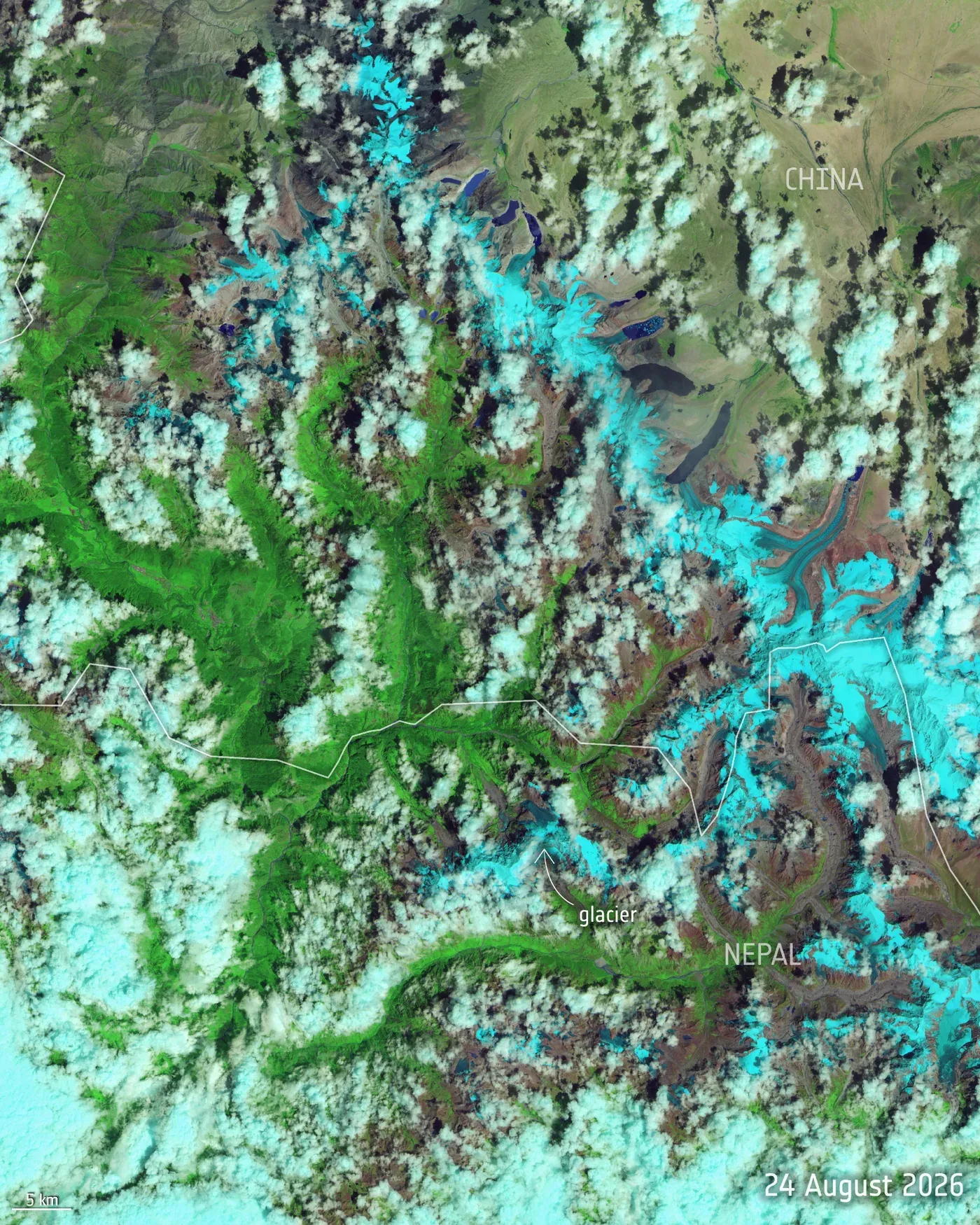 Satellite image of the Himalayas along the Nepal–China border on 24 August 2026, showing green valleys, scattered cloud, glacial lakes and glaciers highlighted in bright blue